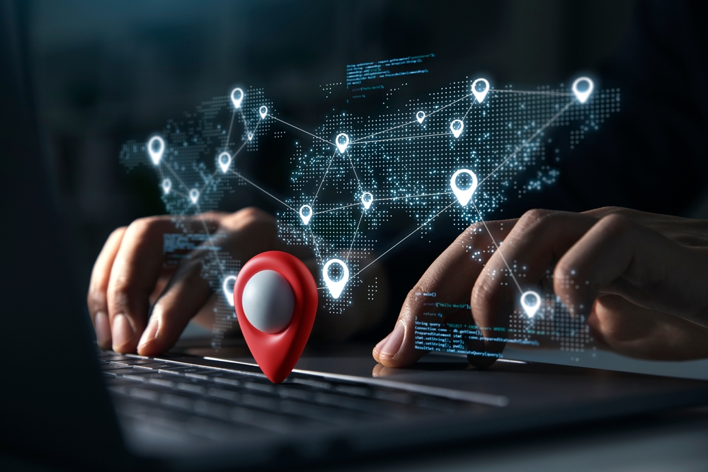 young,man,using,laptop,with,blue,markers,with,user,icons